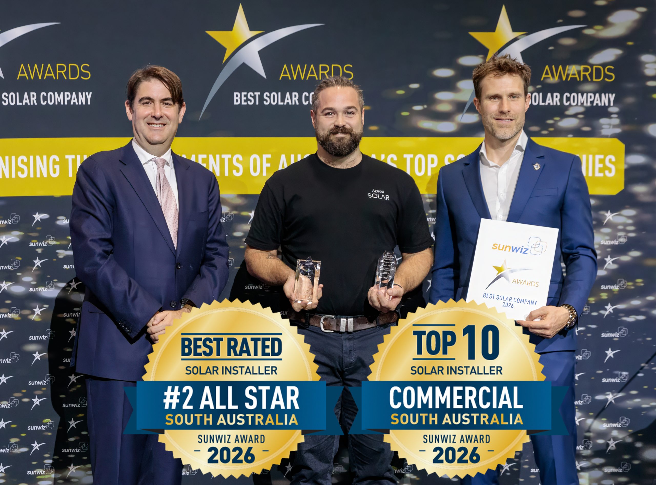 Adam Solar accepting their 2026 SunWiz Award at the Smart Energy Conference, Sydney