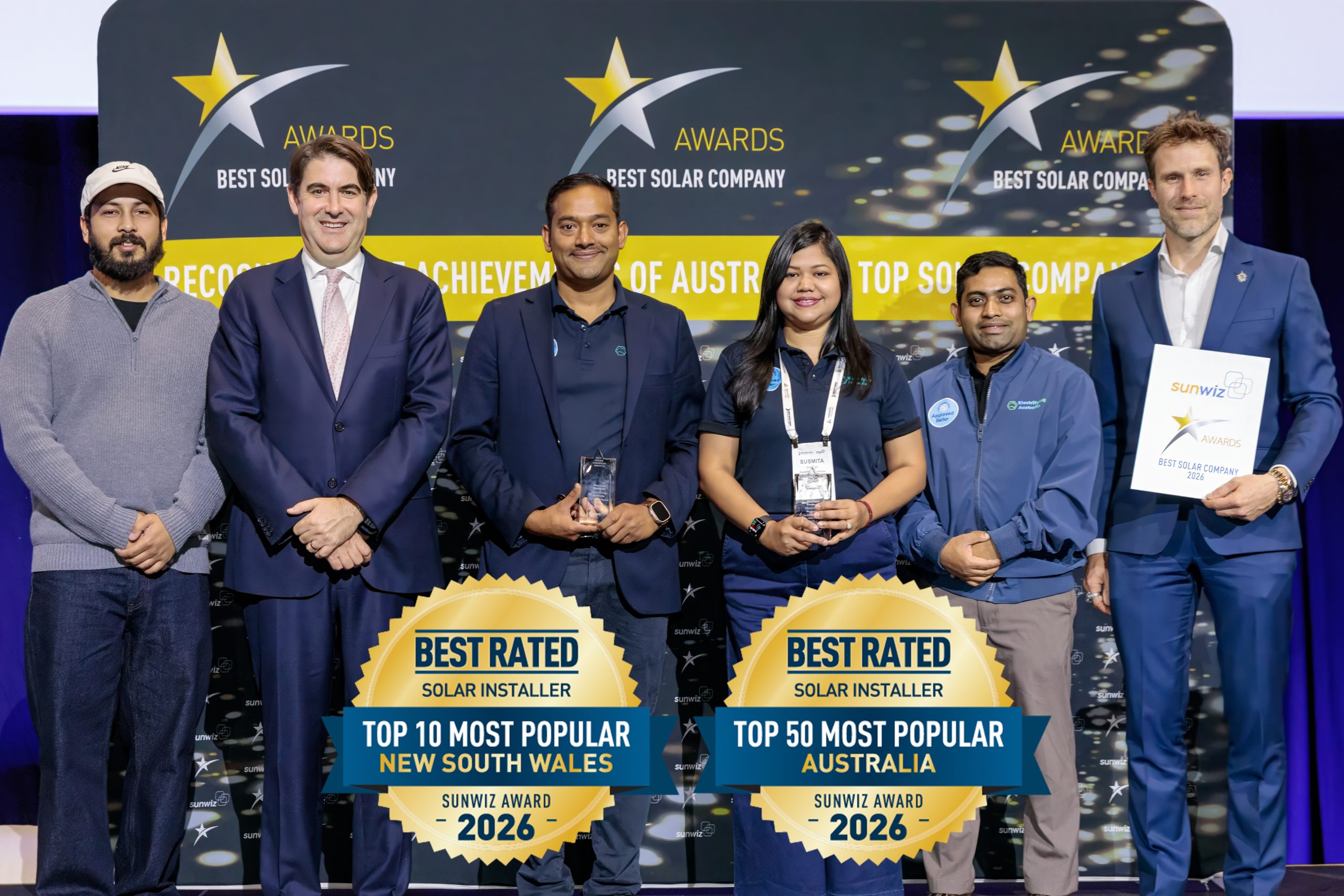 Electrifying Australia accepting their 2026 SunWiz Award at the Smart Energy Conference, Sydney